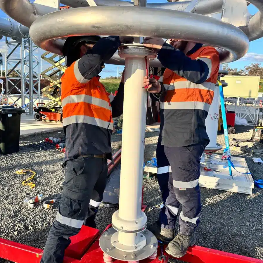 Megavar technicians assembling the voltage divider of a resonant HV test set on site
